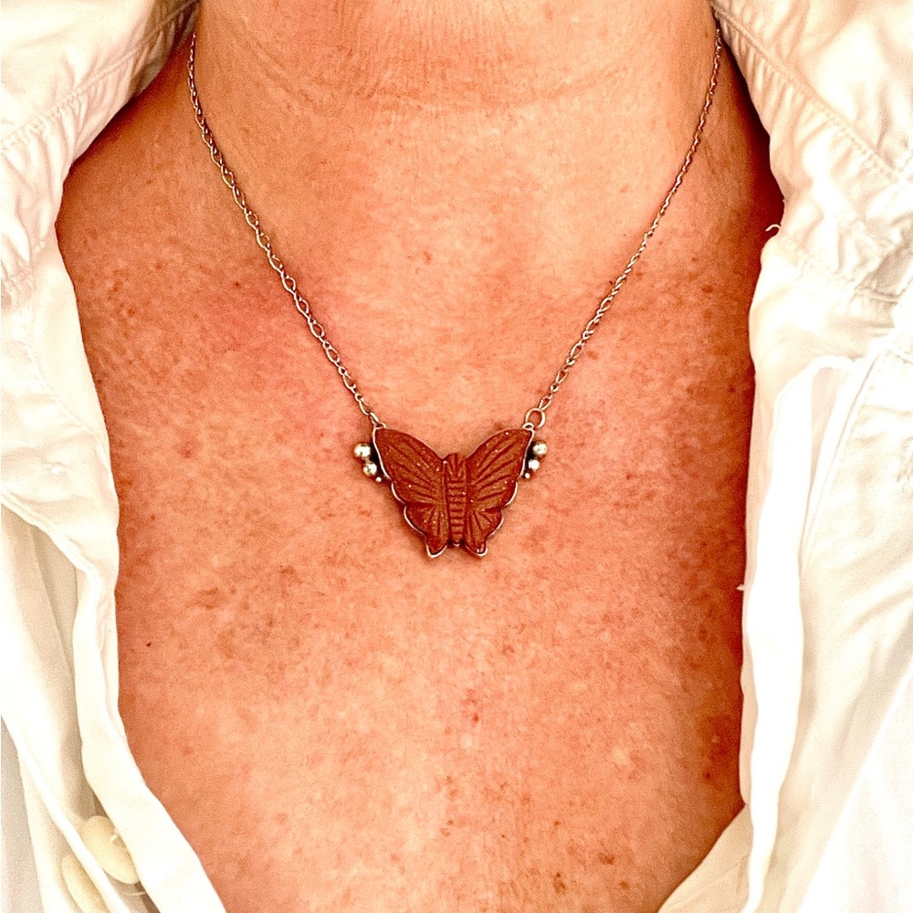 Unlock your inner strength with the sterling silver butterfly pendant. 18”